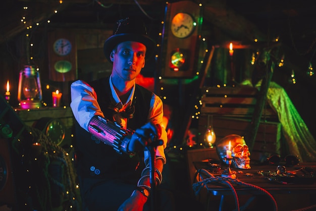 Portrait of male inventor in a steampunk suit, a top hat with a\
cane in hand sits in a watch workshop with neon light. cyberpunk\
cosplay