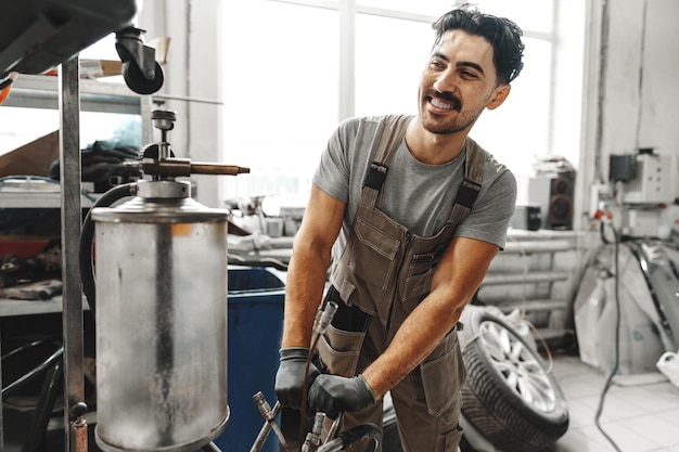 Portrait of a male mechanic in an auto repair shop