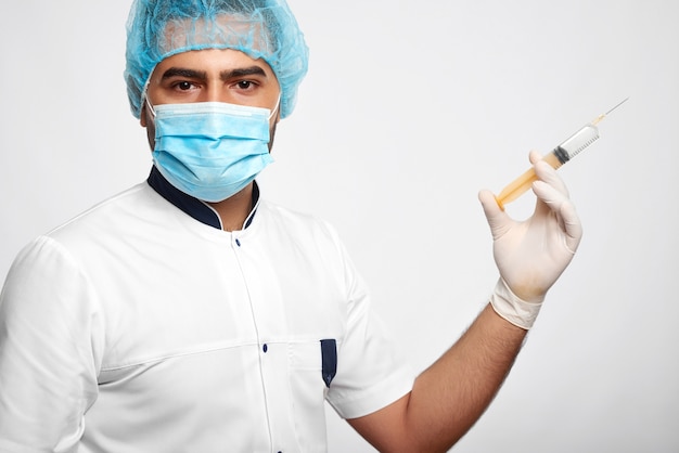 Portrait of a male medical worker in uniform isolated