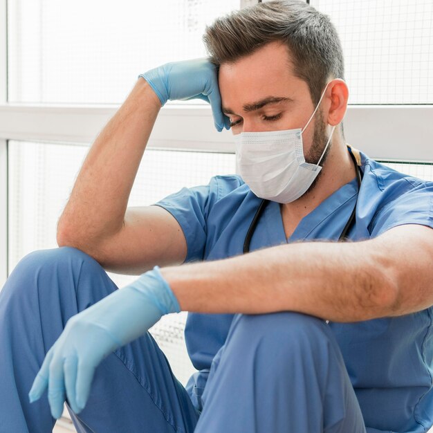 Portrait of male nurse wearing medical mask