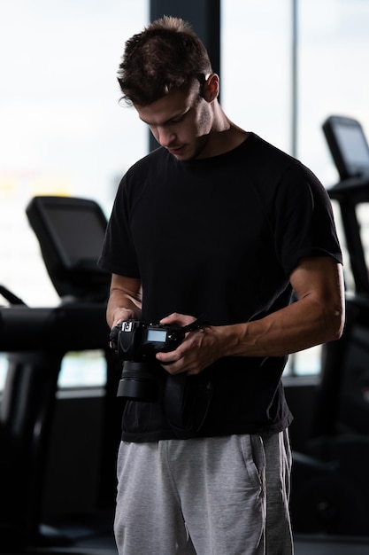 Portrait of Male Photographer Holding Camera