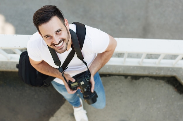 Photo portrait of male photographer with camera