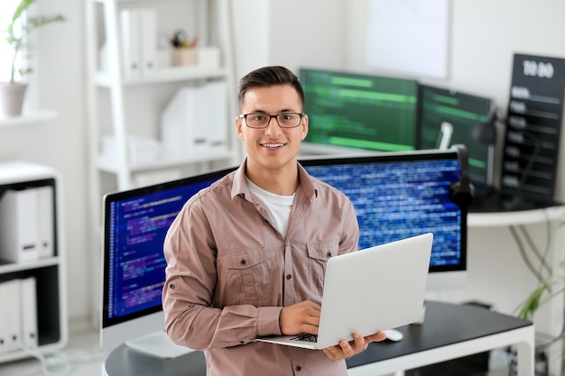 Portrait of male programmer in office