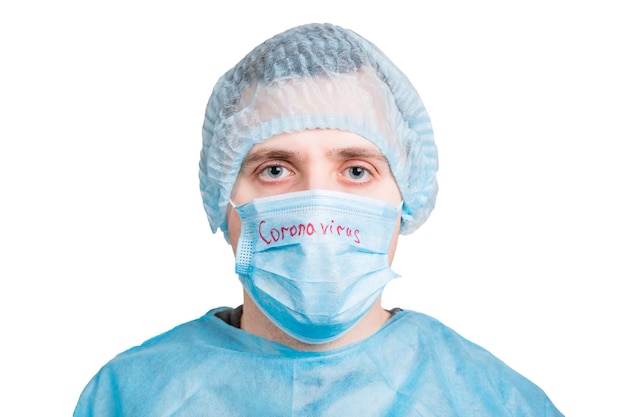 Photo portrait of man against blue background in protection fase mask