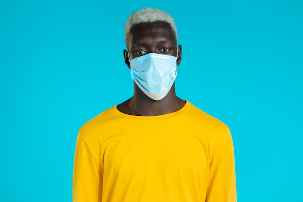 Portrait of man against blue background