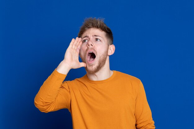 Portrait of man against blue background