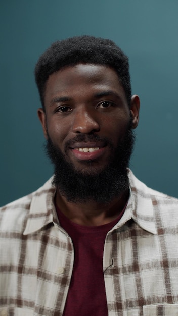 portrait of man against blue background