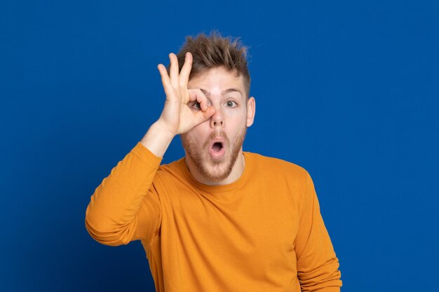 Portrait of man against blue background