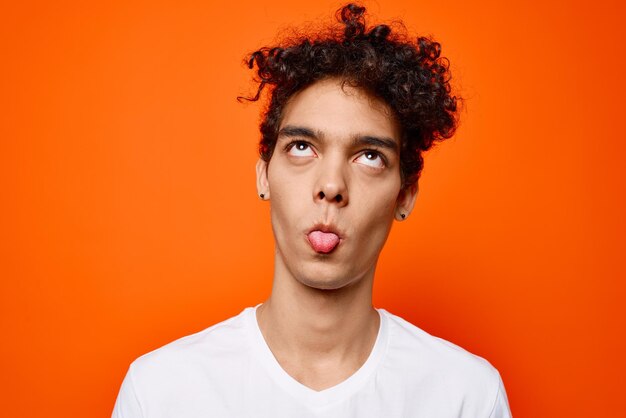 Portrait of man against orange background