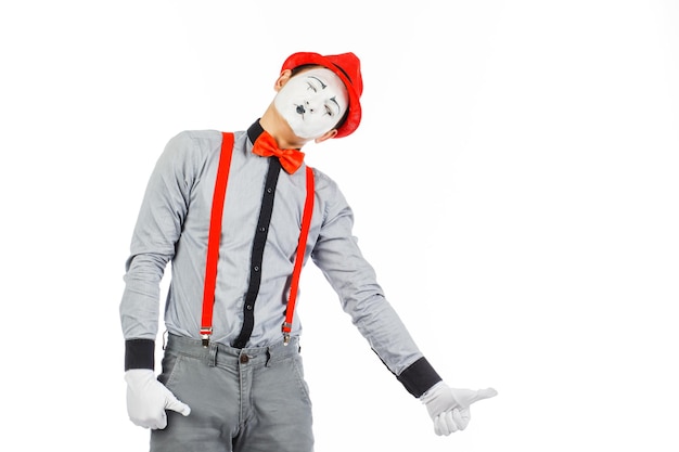 Portrait of a man artistclown MIME Shows something isolated on white background