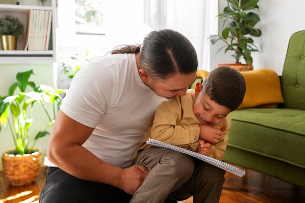 portrait of man celebrating father's day with his chil