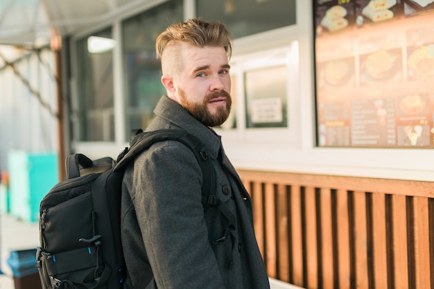 Portrait of man choosing fast food in food truck in the street meal food industry and streetfood