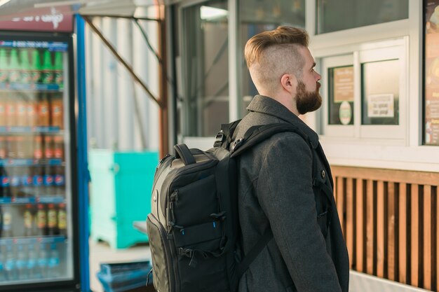 Portrait of man choosing fast food in food truck in the street meal food industry and streetfood