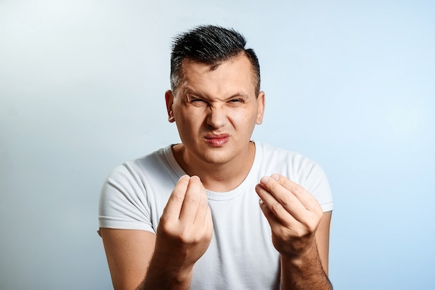 Portrait of a man close-up disgusted