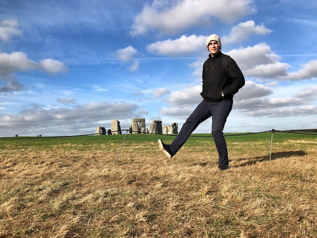 Portrait of man on field against sky