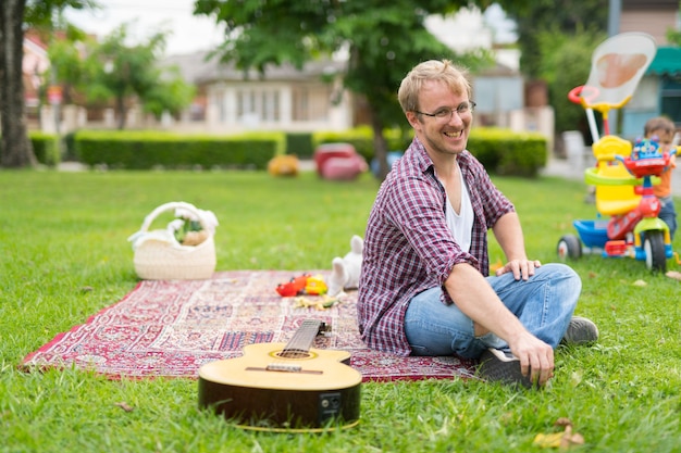 Portrait of man having picnic and relaxing outdoors