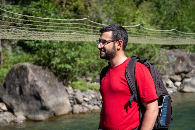 Portrait for man in his adventure in behind the river