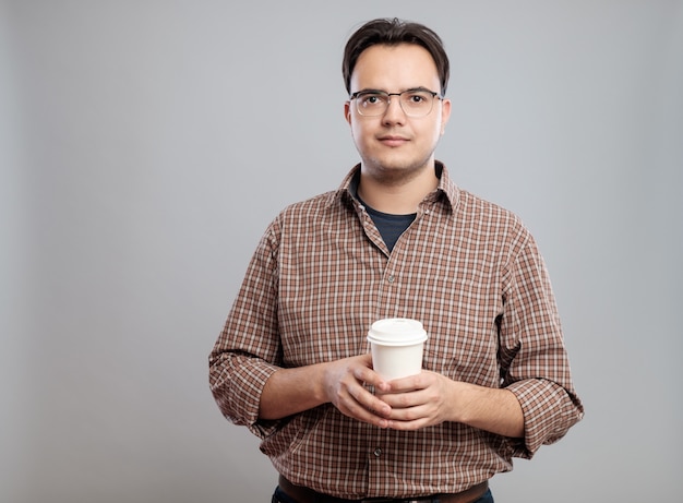 Portrait of man holding a cup of coffee