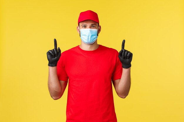 Portrait of man holding umbrella against yellow background