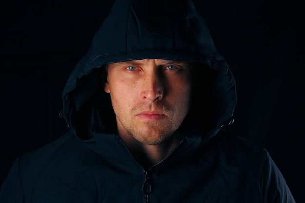 Portrait of a man in a hood