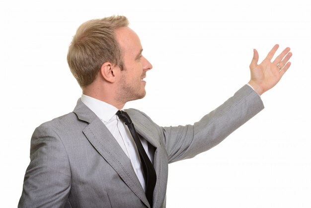 Portrait of man isolated against white wall