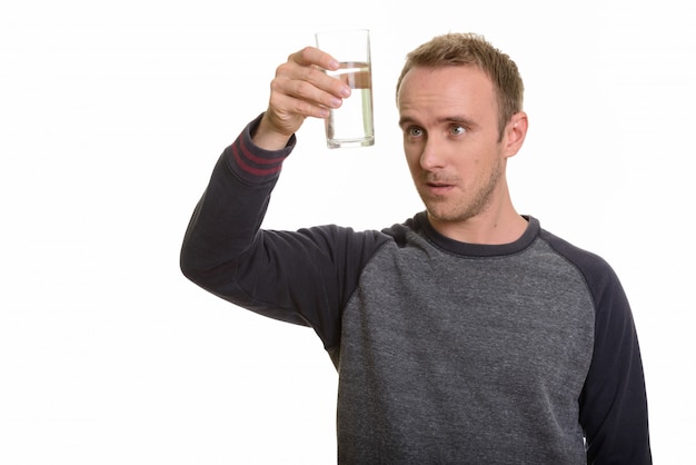 Portrait of man isolated against white wall