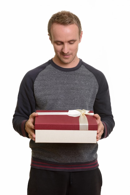 Portrait of man isolated against white wall