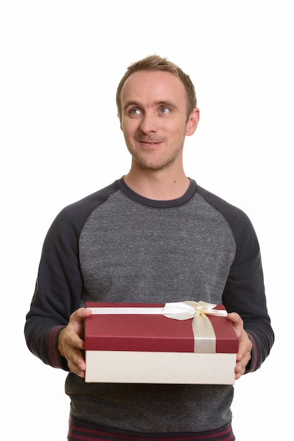 Portrait of man isolated against white wall