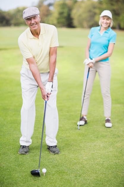 Portrait of man laying golf