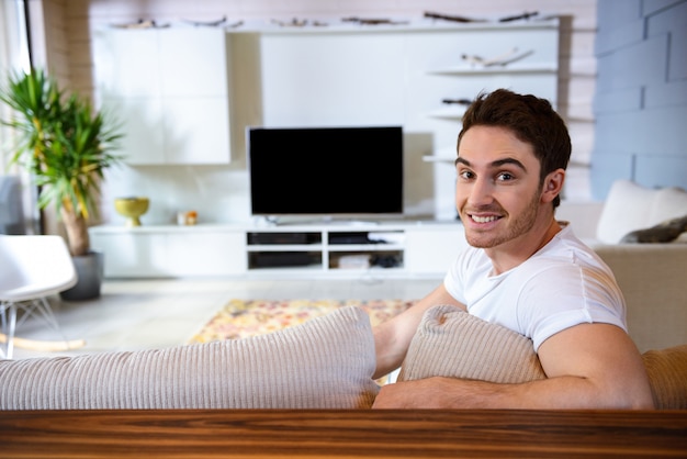 Portrait of man in living room