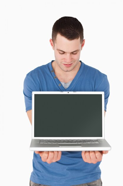 Portrait of a man looking at a laptop