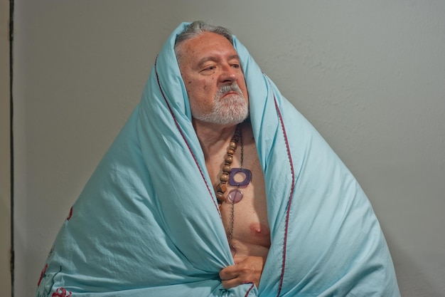 Photo portrait of a man making faces on a wall at home