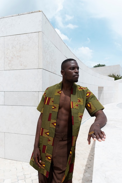 Portrait of man outdoors in traditional african attire