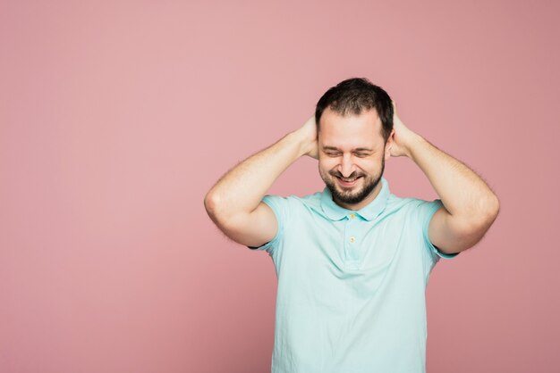 Photo portrait of a man on a pink background