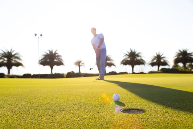 portrait man playing golf