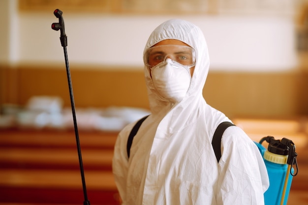 Portrait of man in protective hazmat suit.