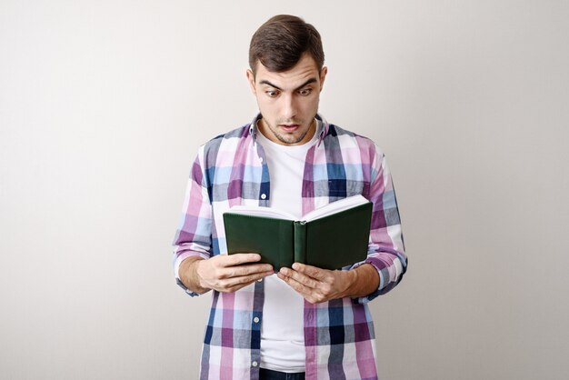 Portrait of a man reading a book