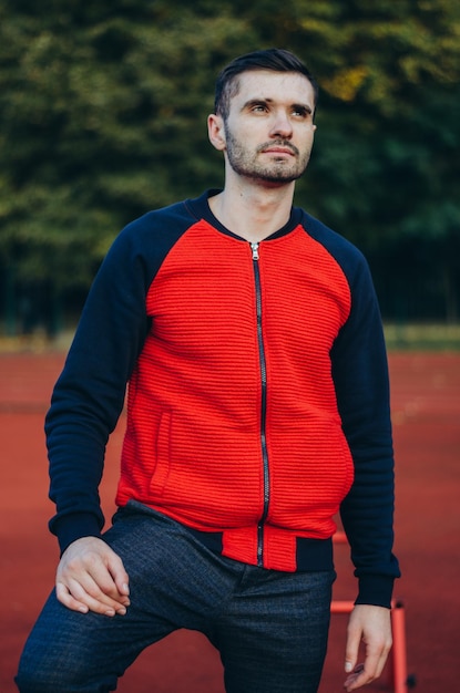 a portrait of a man in a red jacket