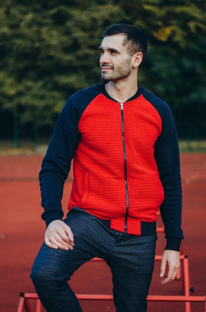 a portrait of a man in a red jacket