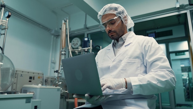 Portrait of a man scientist in uniform working in curative laboratory