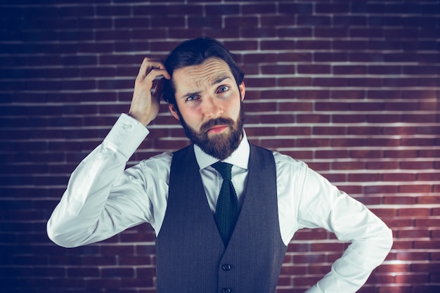 Portrait of man scratching head