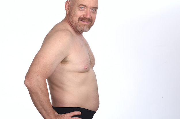 Photo portrait of a man shirtless on white background, side view