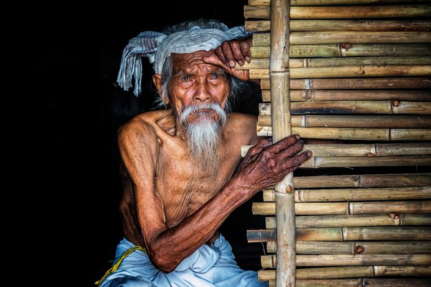 Portrait of man sitting outdoors