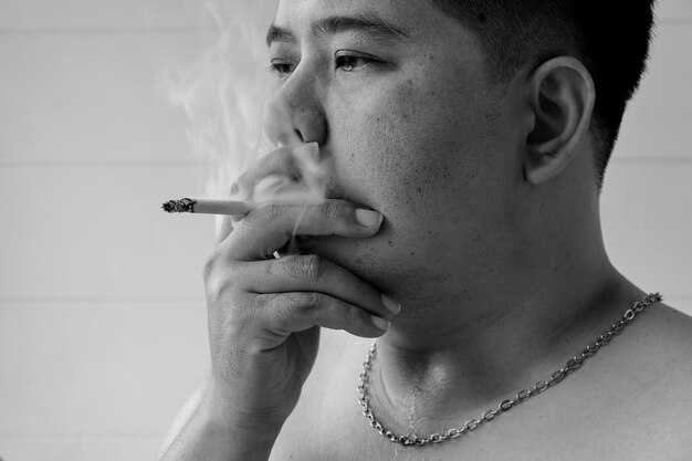 Portrait of man smoking cigarette