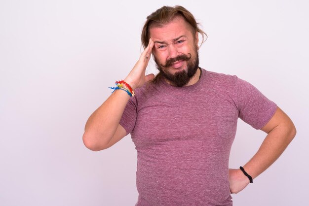 Portrait of man standing against white background