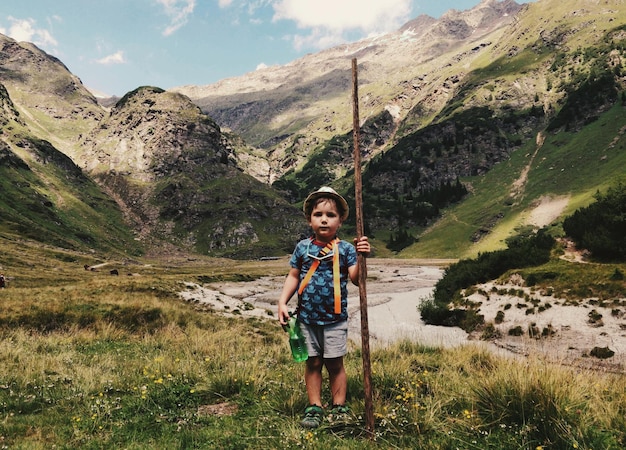 portrait of man standing on mountain