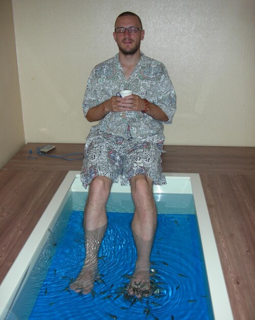 Portrait of man standing in swimming pool