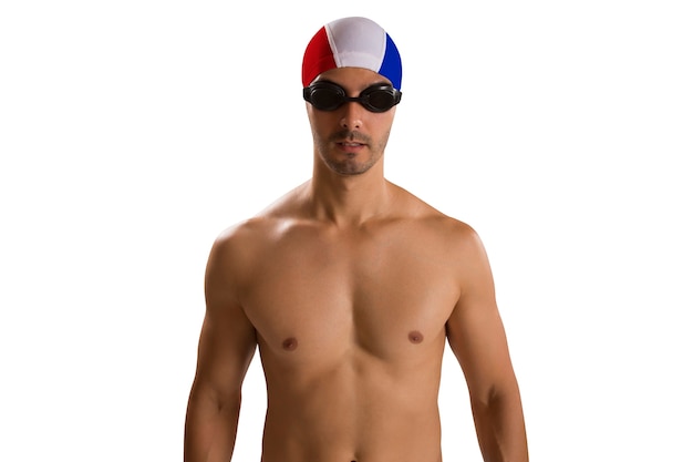 Portrait of man in swimsuit; professional swimmer over white space with French uniform.