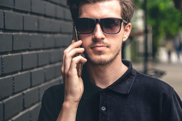 Portrait of a man talking on the phone in the city