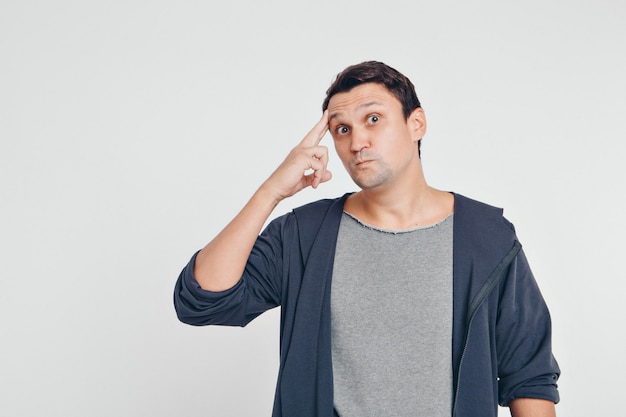 Portrait of man thoughtful. Guy with hands on face isolated on white background